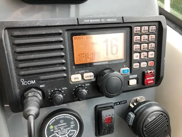 Good Fun Yacht Photos Pics VHF marine radio on 2006 Pursuit 3370 Offshore boat dashboard.