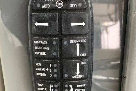 Good Fun Yacht Photos Pics Control panel of a 2006 Pursuit 3370 Offshore boat with navigation buttons.