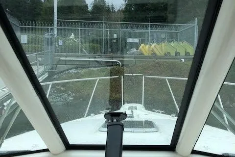 Good Fun Yacht Photos Pics 2006 Pursuit 3370 Offshore boat view from cabin, docked near fenced area.