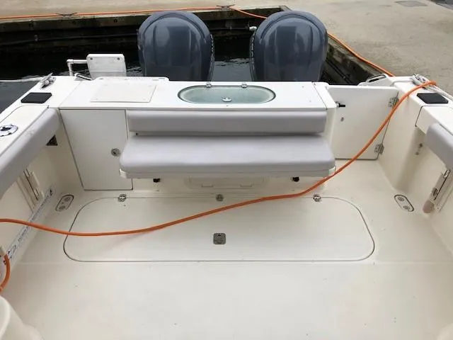 Good Fun Yacht Photos Pics 2006 Pursuit 3370 Offshore boat deck with seating and twin engines.