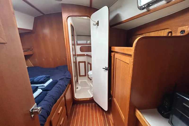 Harriet Tubman Yacht Photos Pics Cozy 2002 Caliber 40 yacht cabin with wooden interior and compact bathroom.