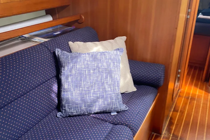 Harriet Tubman Yacht Photos Pics Cozy interior of 2002 Caliber 40 yacht with blue patterned cushions.