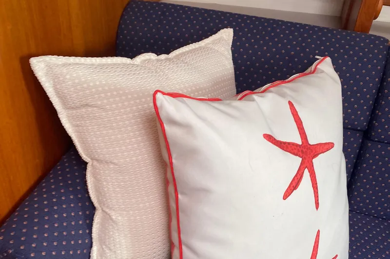 Harriet Tubman Yacht Photos Pics Cushions on a blue patterned sofa inside a 2002 Caliber 40 boat.