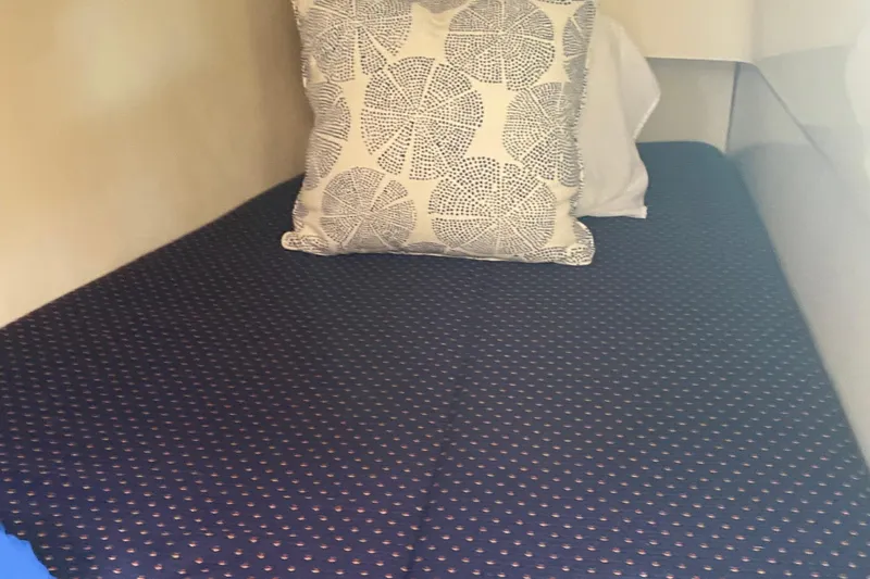 Harriet Tubman Yacht Photos Pics Cozy bed with patterned pillow in 2002 Caliber 40 interior cabin.