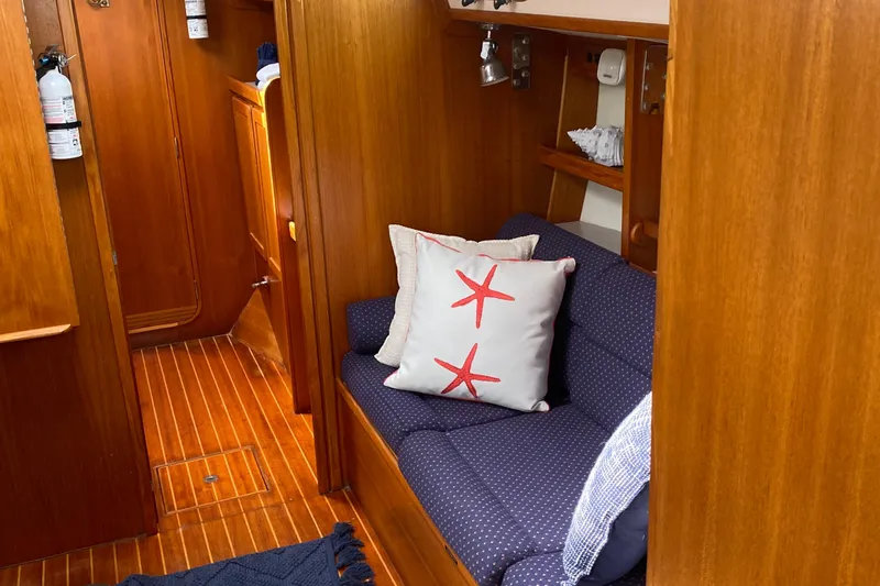 Harriet Tubman Yacht Photos Pics Cozy 2002 Caliber 40 yacht interior with wooden finish and starfish-themed cushions.