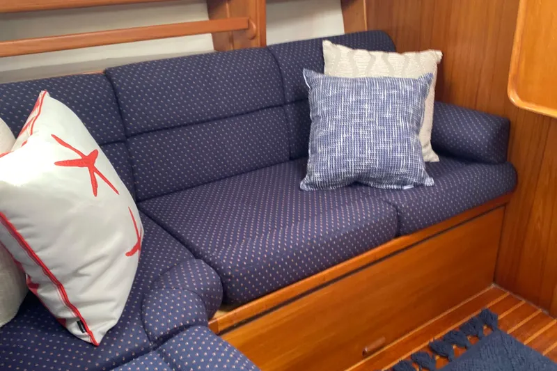 Harriet Tubman Yacht Photos Pics Cozy seating area in 2002 Caliber 40 yacht with patterned cushions and decorative pillows.