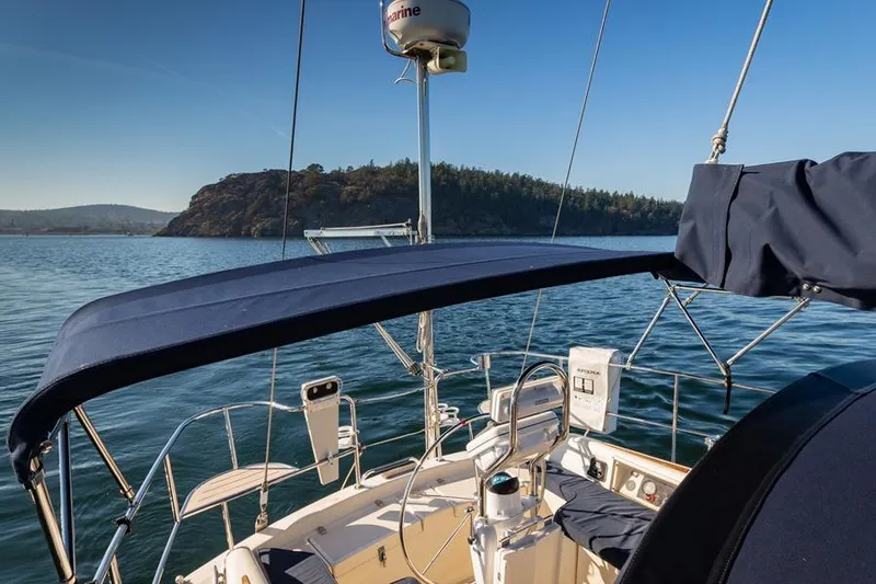 Harriet Tubman Yacht Photos Pics Sailboat Caliber 40 (2002) on serene water with scenic island backdrop.