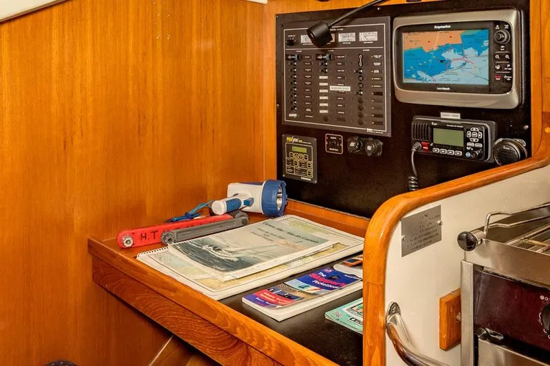 Harriet Tubman Yacht Photos Pics Navigation station on 2002 Caliber 40 yacht with maps, electronics, and flashlight.