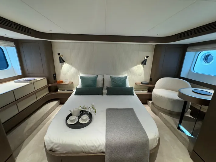  Yacht Photos Pics Luxurious bedroom interior of 2025 Azimut Magellano 66 yacht with modern decor and cozy ambiance.