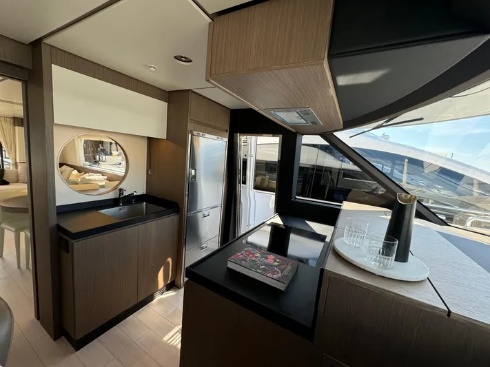  Yacht Photos Pics Luxurious interior of 2025 Azimut Magellano 66 yacht with modern kitchen design.