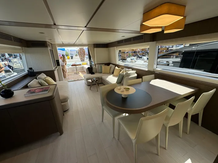  Yacht Photos Pics Luxurious interior of 2025 Azimut Magellano 66 yacht with modern furnishings and large windows.