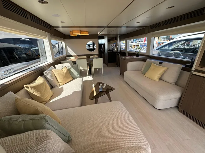  Yacht Photos Pics Luxurious interior of 2025 Azimut Magellano 66 yacht with elegant seating and dining area.