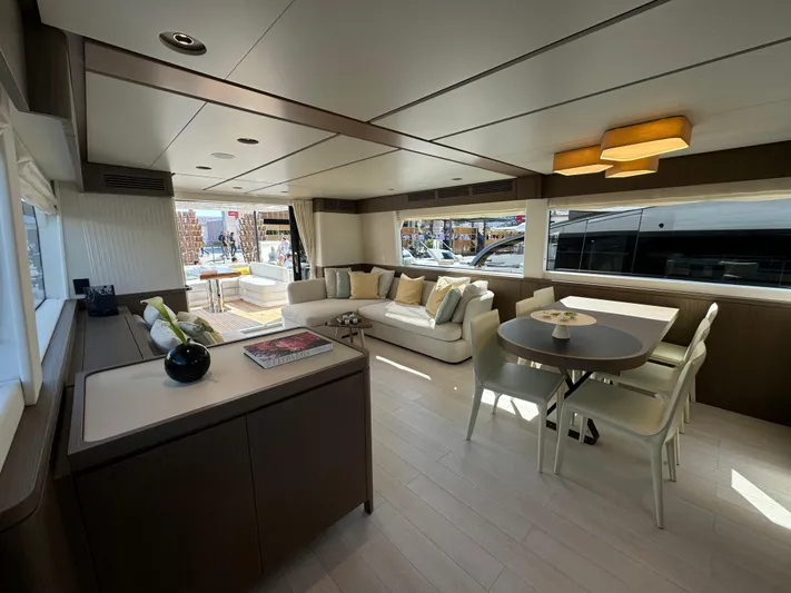  Yacht Photos Pics Luxurious interior of 2025 Azimut Magellano 66 yacht with modern furnishings and ample natural light.