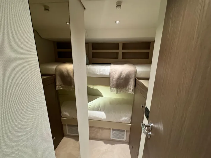  Yacht Photos Pics 2025 Azimut Magellano 66 yacht cabin with cozy bunk beds and modern design.