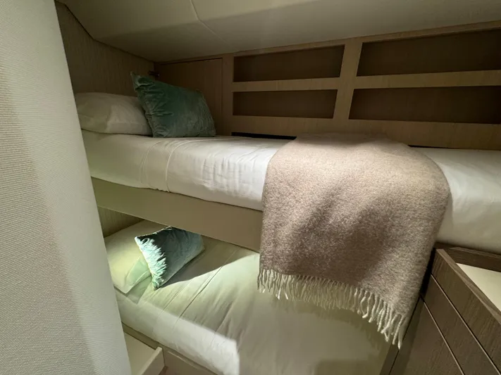  Yacht Photos Pics Bunk beds in 2025 Azimut Magellano 66 yacht cabin with cozy bedding and pillows.