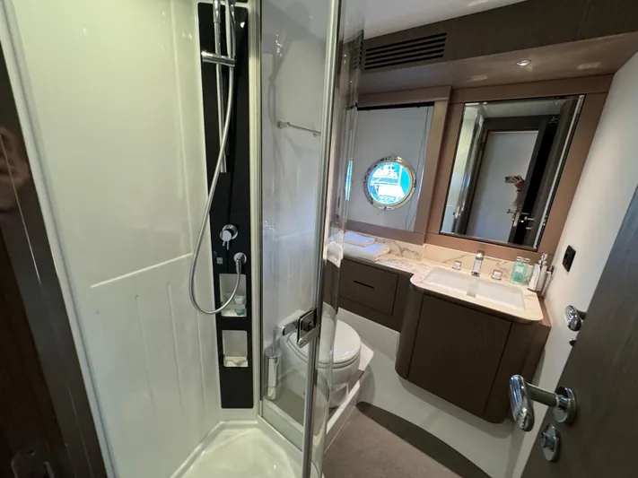 Yacht Photos Pics Luxurious bathroom in 2025 Azimut Magellano 66 yacht with modern shower and vanity.