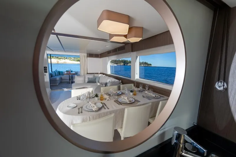  Yacht Photos Pics Luxurious dining area on 2025 Azimut Magellano 66 yacht with ocean view.