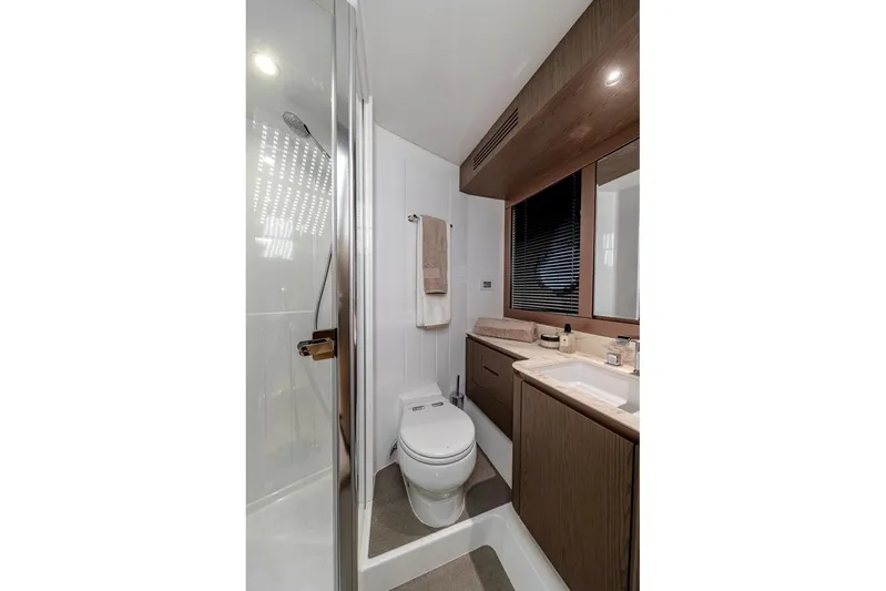  Yacht Photos Pics Luxurious bathroom in 2025 Azimut Magellano 66 yacht with modern fixtures and elegant design.