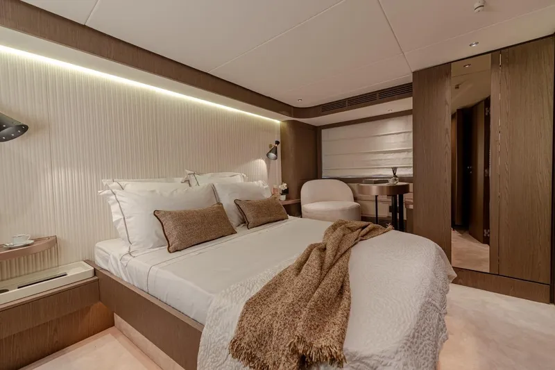  Yacht Photos Pics Luxurious bedroom interior of 2025 Azimut Magellano 66 yacht, featuring elegant design and cozy ambiance.