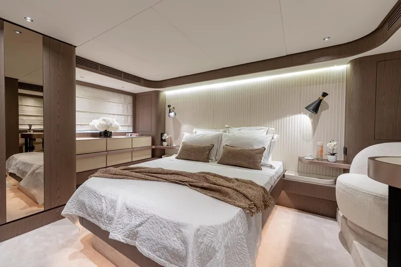  Yacht Photos Pics Luxurious bedroom interior of 2025 Azimut Magellano 66 yacht, featuring elegant design and modern amenities.