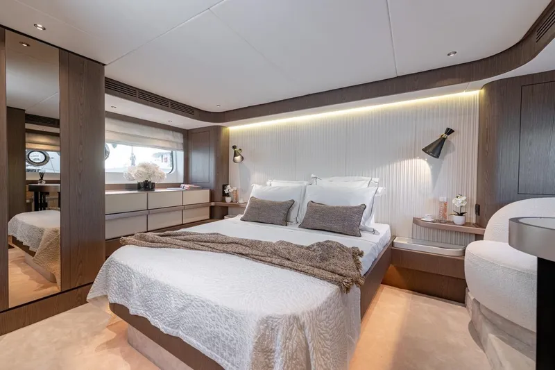  Yacht Photos Pics Luxurious bedroom interior of 2025 Azimut Magellano 66 yacht, featuring modern design and elegant decor.