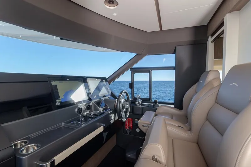  Yacht Photos Pics Luxurious helm of 2025 Azimut Magellano 66 yacht with modern navigation systems.