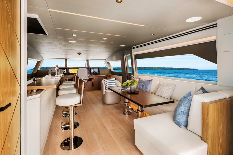 Horizon Fd80-617 / Now Available Yacht Photos Pics Luxurious interior of 2026 Horizon FD80 yacht with ocean view, modern seating, and elegant decor.