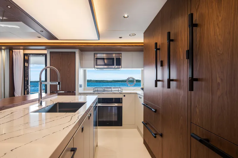 Horizon Fd80-617 / Now Available Yacht Photos Pics Luxurious kitchen interior on 2026 Horizon FD80 yacht with ocean view.