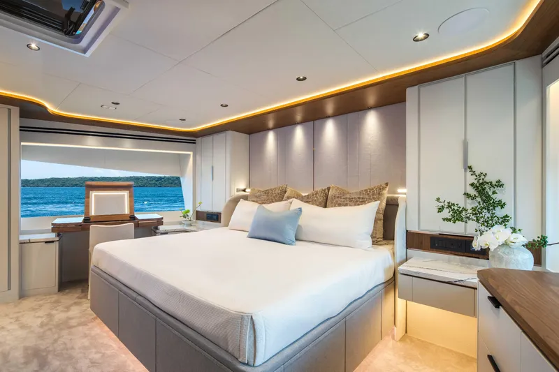 Horizon Fd80-617 / Now Available Yacht Photos Pics Luxurious bedroom interior on 2026 Horizon FD80 yacht with ocean view and elegant decor.