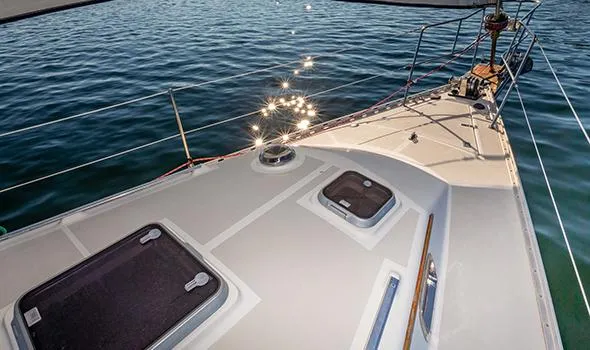 Harriet Tubman Yacht Photos Pics Sailboat deck of 2002 Caliber 40 with sparkling water reflections.