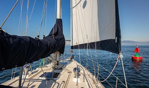 Harriet Tubman Yacht Photos Pics Sailboat Caliber 40 (2002) navigating near a red buoy on a clear day.