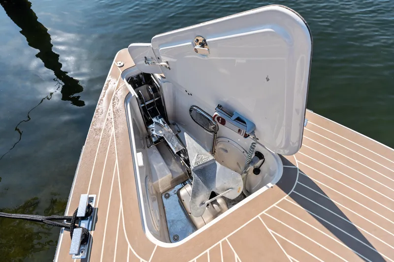 R01 Yacht Photos Pics Open anchor compartment on 2023 VanDutch 32 boat, showcasing storage and mechanism.
