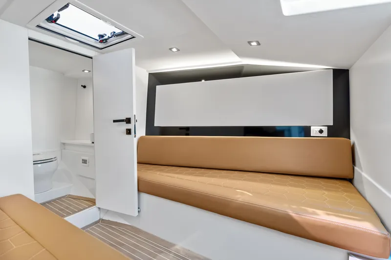 R01 Yacht Photos Pics Interior of 2023 VanDutch 32 yacht with modern seating and sleek design.