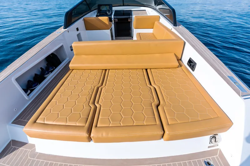 R01 Yacht Photos Pics Luxurious 2023 VanDutch 32 yacht with tan leather seating and sleek design on open water.