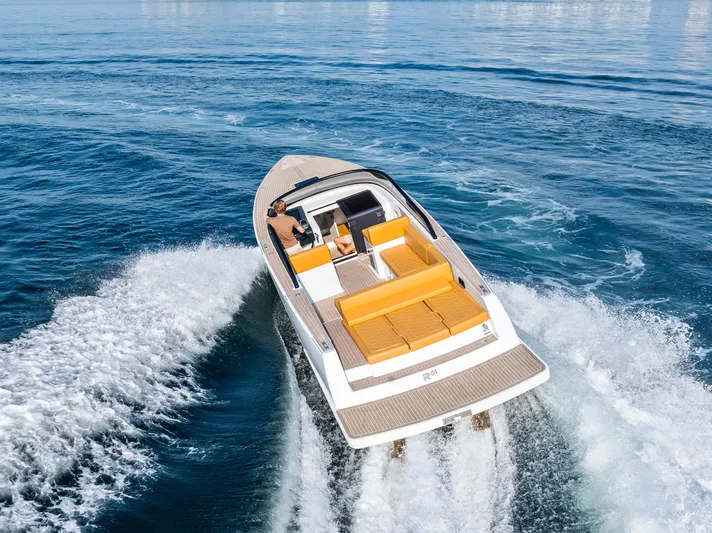 R01 Yacht Photos Pics 2023 VanDutch 32 yacht cruising on open water, featuring sleek design and luxurious seating.