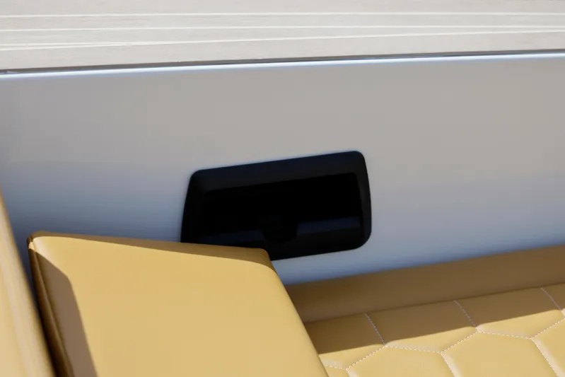 R01 Yacht Photos Pics VanDutch 32 boat interior, featuring tan leather seating and sleek white paneling, 2023 model.