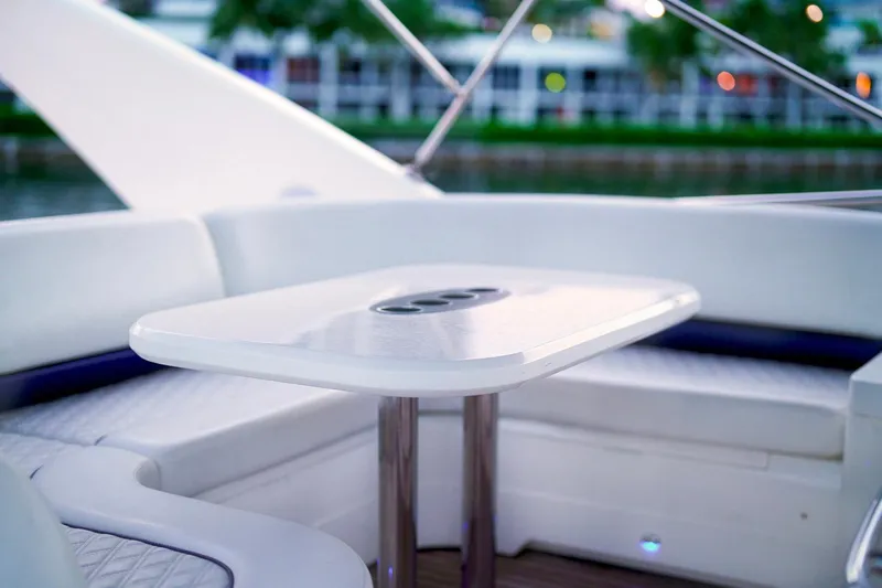 Kristina Yacht Photos Pics Luxurious seating area on a 2007 Princess 23M yacht with sleek white table.