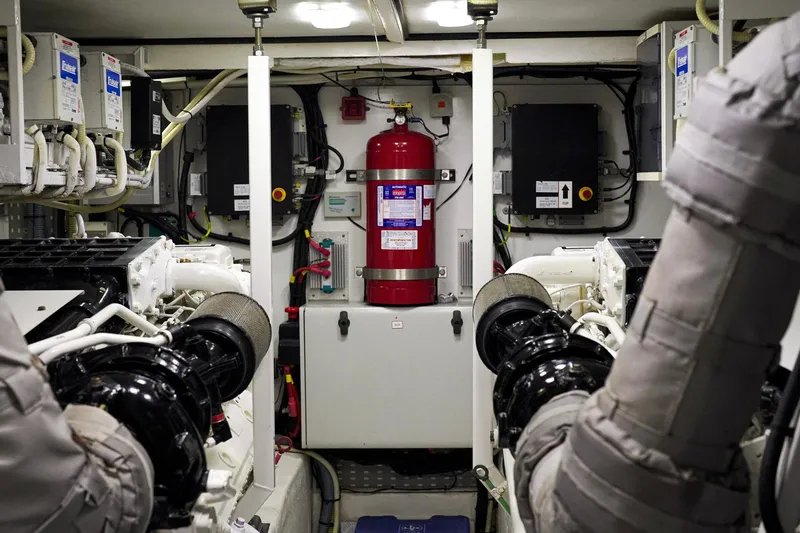 Kristina Yacht Photos Pics Engine room of 2007 Princess 23M yacht with fire extinguisher and machinery.
