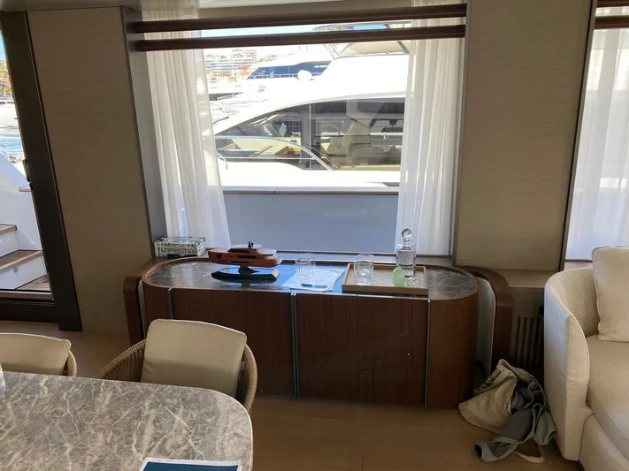 Yacht Photos Pics Luxurious interior of 2024 Azimut Magellano 30M yacht with elegant furnishings and large windows.