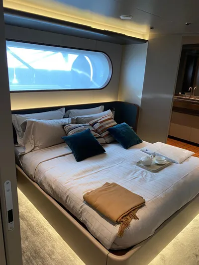  Yacht Photos Pics Luxurious bedroom interior of 2024 Azimut Magellano 30M yacht with modern design.