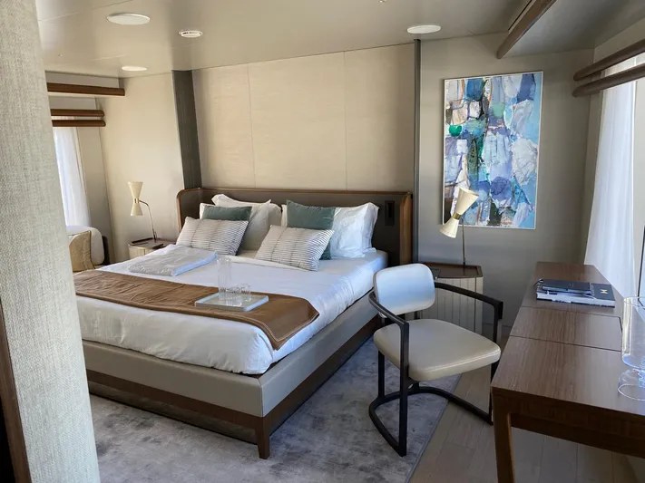  Yacht Photos Pics Luxurious bedroom interior on 2024 Azimut Magellano 30M yacht, featuring modern decor and elegant furnishings.
