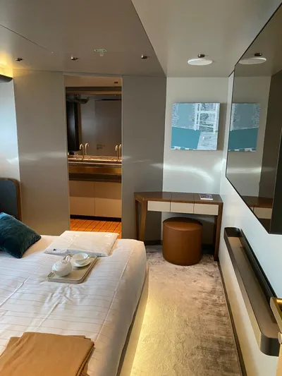  Yacht Photos Pics Luxurious bedroom interior of 2024 Azimut Magellano 30M yacht with modern decor.