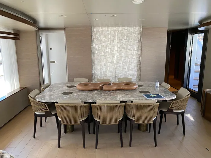  Yacht Photos Pics Luxurious dining area on 2024 Azimut Magellano 30M yacht with elegant table and chairs.