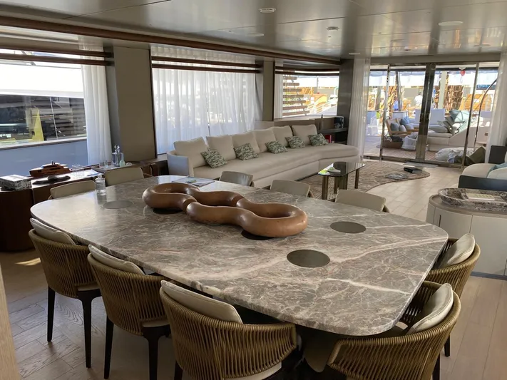  Yacht Photos Pics Luxurious interior of 2024 Azimut Magellano 30M yacht with elegant dining and seating areas.