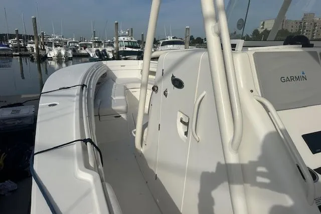 Resolute Yacht Photos Pics 2017 Regulator 31 boat docked, featuring Garmin equipment, in a marina setting.