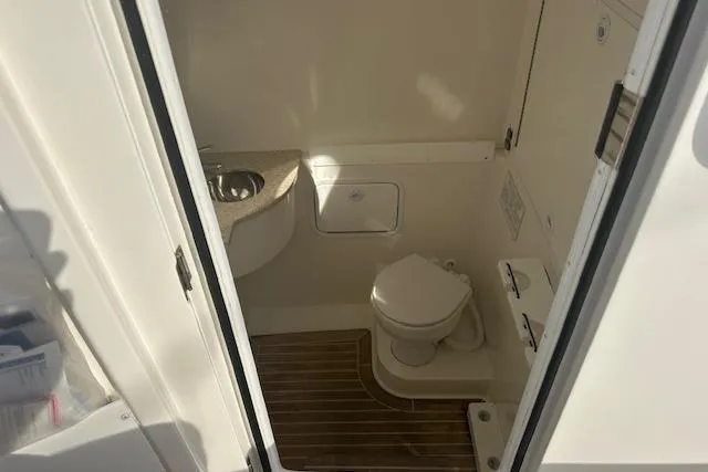 Resolute Yacht Photos Pics 2017 Regulator 31 boat interior bathroom with toilet and sink.