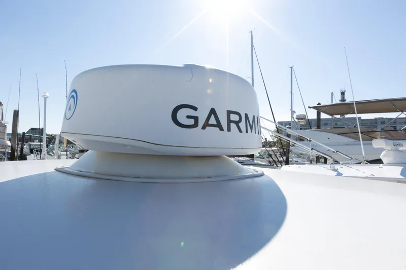 Resolute Yacht Photos Pics Garmin radar on 2017 Regulator 31 boat under clear sky at marina.