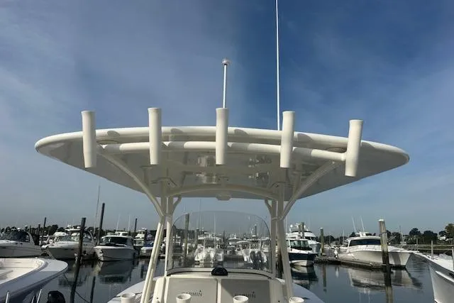 Resolute Yacht Photos Pics 2017 Regulator 31 boat docked at marina under clear blue sky.