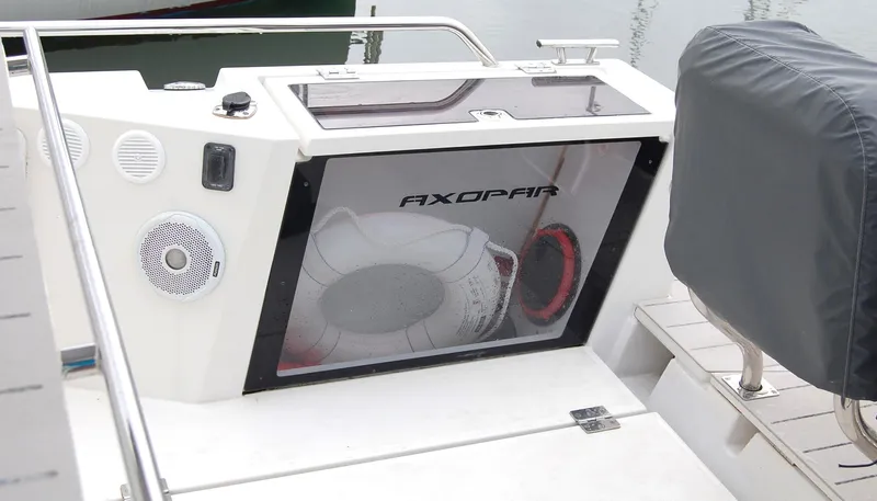  Yacht Photos Pics 2019 Axopar 37 SC boat interior with speaker and storage compartment.