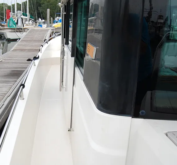  Yacht Photos Pics 2019 Axopar 37 SC boat docked at marina, side view with walkway and windows.